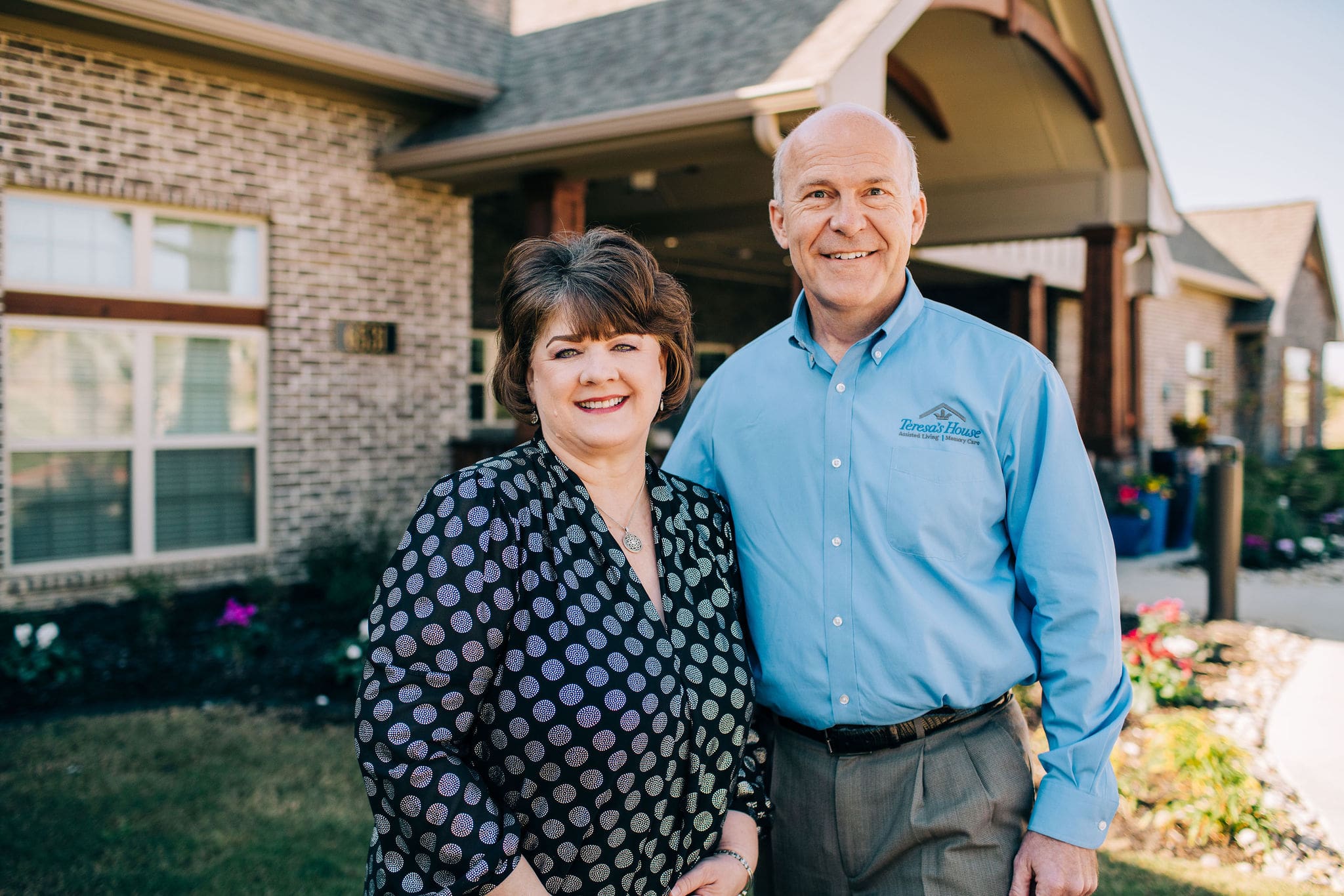 The Owners of Teresa's House standing out front of the building