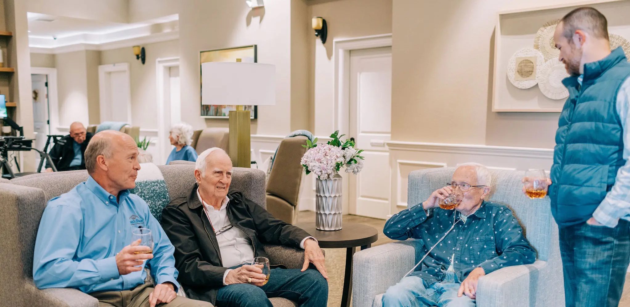 Four Men Socializing at Teresa's House Senior Care Facility in McKinney